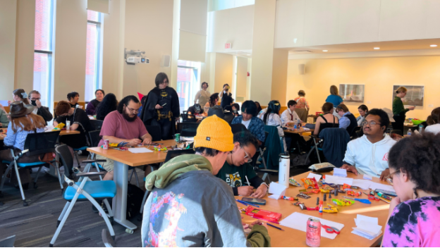 Students create their own zines during the Hallowzines event hosted by George Mason University Libraries.